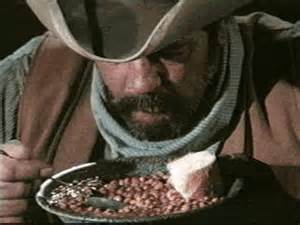 picture of cowboy, eating beans
